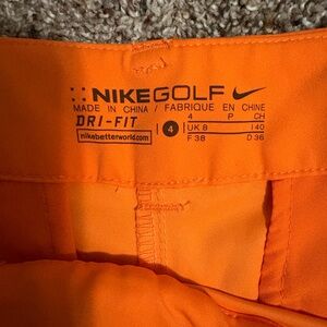 Nike Golf Vibrant Orange Dri-Fit Apparel